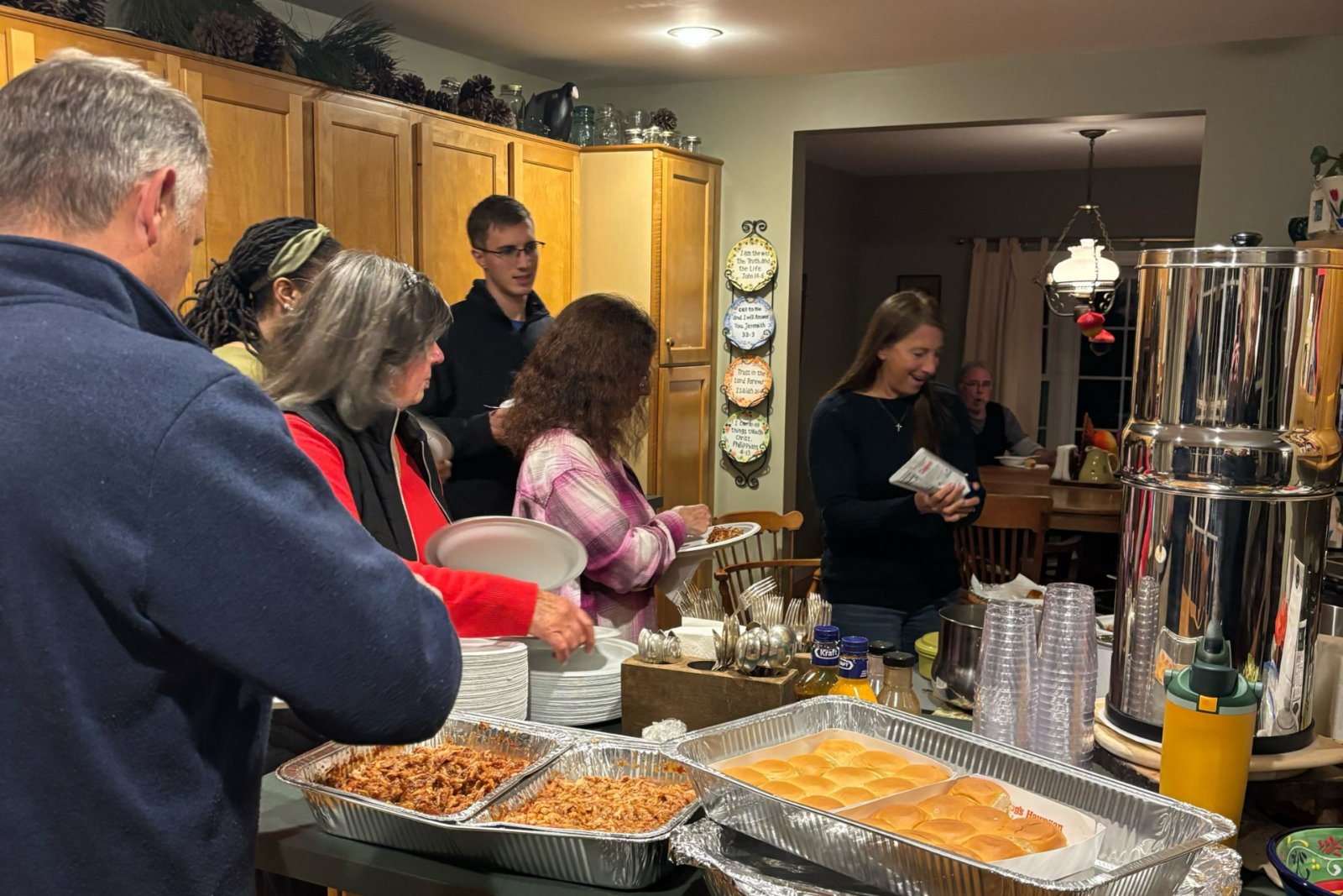 A Quidnessett Community Group sharing a meal together
