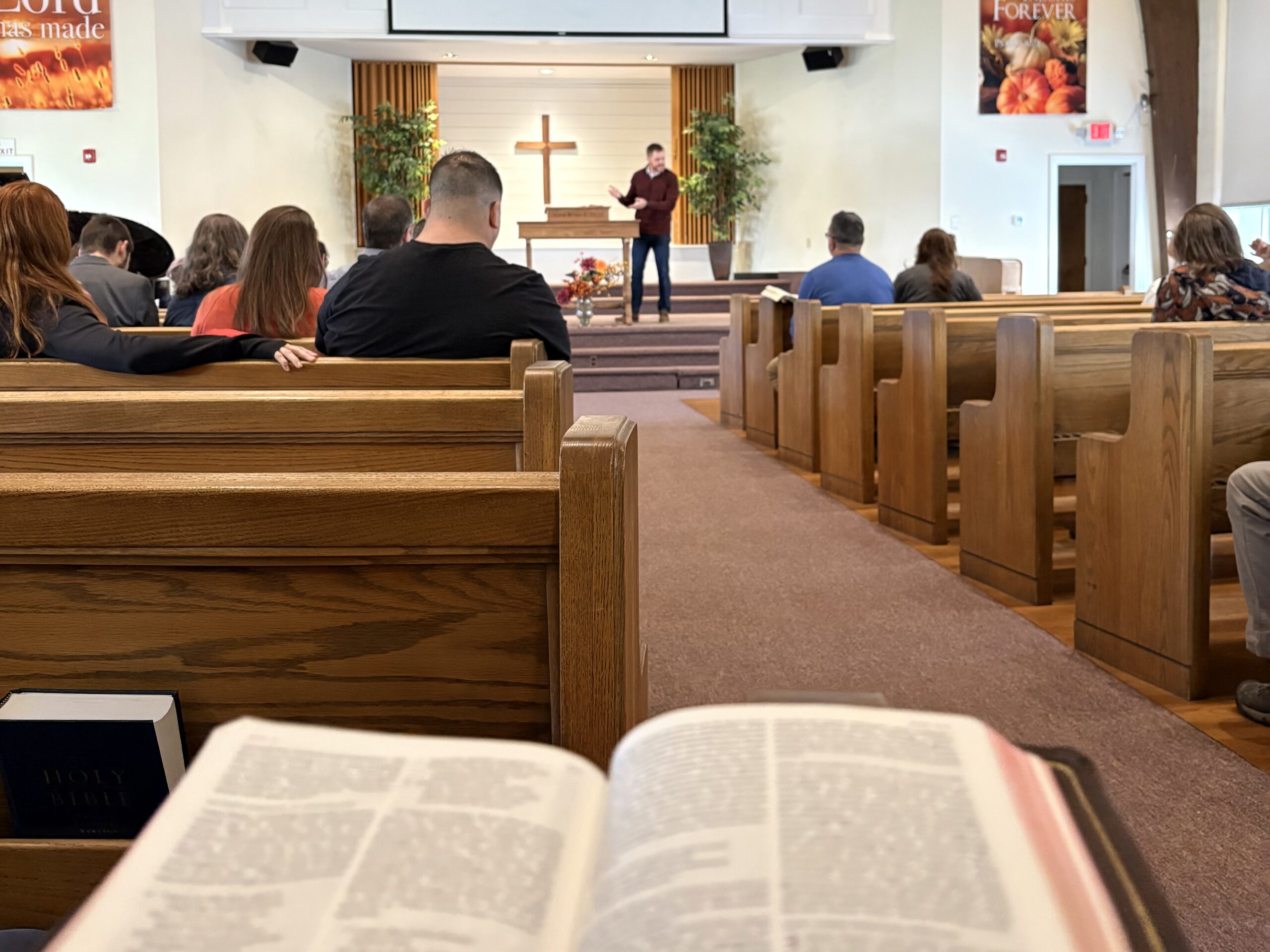 An open Bible in the pews during the sermon