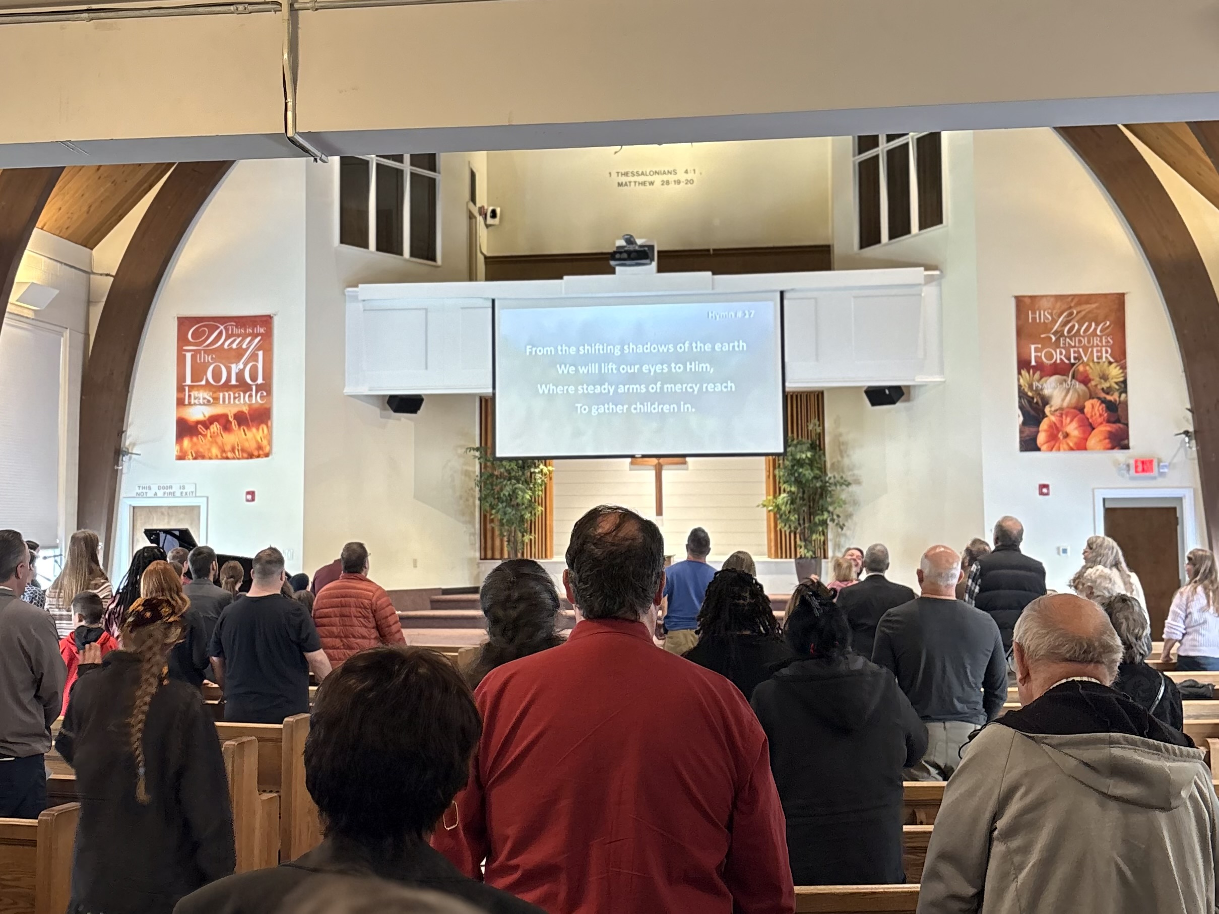 The congregation singing together in Sunday worship