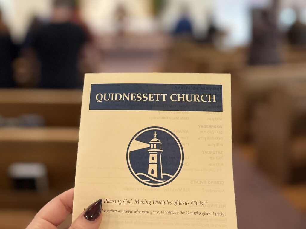 A Sunday bulletin in hand before the service